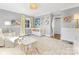 Spacious Bedroom with light furniture, patterned curtains, a crib, and hardwood floors at 1310 Woodland Dr, Charlotte, NC 28205