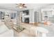 Open-concept living room featuring a fireplace and hardwood floors at 1310 Woodland Dr, Charlotte, NC 28205