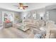 Cozy living room filled with light and comfortable seating at 1310 Woodland Dr, Charlotte, NC 28205
