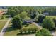 Aerial view of a single-story home surrounded by lush greenery and trees at 139 Fort Dobbs Rd, Statesville, NC 28625