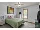 This bedroom features carpet, a ceiling fan, one window, a double bed, and white walls at 139 Fort Dobbs Rd, Statesville, NC 28625