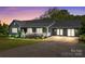 Charming gray home with a welcoming porch, white railings, and well-maintained landscaping at 139 Fort Dobbs Rd, Statesville, NC 28625