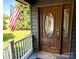 Front door with stained wood and leaded glass oval and sidelight at 139 Fort Dobbs Rd, Statesville, NC 28625