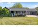 Charming single-story home featuring a landscaped front yard and inviting front porch at 139 Fort Dobbs Rd, Statesville, NC 28625
