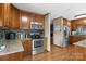 This kitchen features wooden cabinets, stainless steel appliances, and a backsplash for a modern cooking experience at 139 Fort Dobbs Rd, Statesville, NC 28625