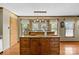 Kitchen island with seating and ample storage space; good natural light from windows at 139 Fort Dobbs Rd, Statesville, NC 28625