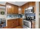 Enjoy cooking in this kitchen, featuring stainless steel appliances, wooden cabinets, and granite countertops at 139 Fort Dobbs Rd, Statesville, NC 28625