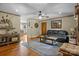 Cozy living room with hardwood floors, ceiling fan, and comfortable furnishings at 139 Fort Dobbs Rd, Statesville, NC 28625