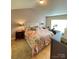 Bedroom with a large bed and a Peloton bike by the window at 14022 Drake Watch Ln, Charlotte, NC 28262