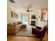Comfortable living room with a fireplace, ceiling fan, and sliding glass doors to the patio at 14022 Drake Watch Ln, Charlotte, NC 28262