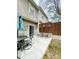 This relaxing patio has a table and chairs and a brown wooden fence at 14022 Drake Watch Ln, Charlotte, NC 28262
