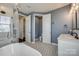 Modern bathroom featuring double vanity, glass-enclosed shower, stylish tile flooring, and separate toilet room at 14905 Skyscape Dr, Huntersville, NC 28078