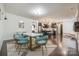 Open-concept dining area with modern décor, stylish lighting, and easy flow into the kitchen at 14905 Skyscape Dr, Huntersville, NC 28078