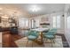 Open-concept dining area with fireplace and seamless flow to the kitchen and backyard at 14905 Skyscape Dr, Huntersville, NC 28078