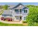 Charming two-story home boasts a welcoming front porch and a second-story balcony at 14905 Skyscape Dr, Huntersville, NC 28078