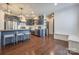 Modern kitchen with stainless steel appliances, stylish cabinets, and seamless flow into dining at 14905 Skyscape Dr, Huntersville, NC 28078