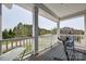 A covered porch offers a seating area and views of the street at 14905 Skyscape Dr, Huntersville, NC 28078