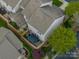 An aerial view of townhomes that feature fenced backyards and patio areas at 2001 Cramer Place Ct, Cramerton, NC 28032