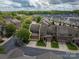 Aerial view of a neighborhood featuring townhomes and manicured lawns with mature shade trees at 2001 Cramer Place Ct, Cramerton, NC 28032