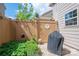 Cozy backyard features a small garden, brick patio, and privacy fence at 2001 Cramer Place Ct, Cramerton, NC 28032