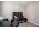This bedroom features carpet floors, a modern TV, and essential furniture for work or entertainment at 2001 Cramer Place Ct, Cramerton, NC 28032