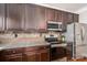 Modern kitchen features stainless steel appliances, granite countertops, and ample cabinet space at 2001 Cramer Place Ct, Cramerton, NC 28032