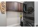 A modern laundry room is equipped with an LG WashTower and overhead cabinet at 2001 Cramer Place Ct, Cramerton, NC 28032
