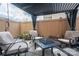 Outdoor patio with comfortable seating under a pergola and privacy fence at 2001 Cramer Place Ct, Cramerton, NC 28032