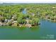 Majestic aerial view of waterfront homes nestled in a lush, wooded landscape with lake access at 2045 Manila Bay Ln, Tega Cay, SC 29708
