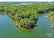 Expansive aerial view of waterfront property on a peninsula, offering stunning lake views from every angle at 2045 Manila Bay Ln, Tega Cay, SC 29708