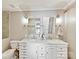 This bathroom includes double sinks, elegant fixtures, and neutral paint at 2045 Manila Bay Ln, Tega Cay, SC 29708