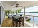 Outdoor deck with table and chairs overlooking the lake at 2045 Manila Bay Ln, Tega Cay, SC 29708