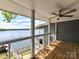 Enjoy lake views from this relaxing deck featuring a ceiling fan and wooden floors at 2045 Manila Bay Ln, Tega Cay, SC 29708