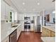 Bright kitchen with stainless steel appliances and white cabinets at 2045 Manila Bay Ln, Tega Cay, SC 29708