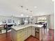 Open floor plan featuring the kitchen with an island, a dining room, and a living room at 2045 Manila Bay Ln, Tega Cay, SC 29708