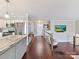 Open floor plan with hardwood floors, glass railings, and modern décor at 2045 Manila Bay Ln, Tega Cay, SC 29708