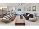 Spacious living room with hardwood floors, plush seating, and a TV, perfect for relaxation and entertainment at 2045 Manila Bay Ln, Tega Cay, SC 29708