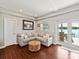 Inviting living room with comfortable seating and access to a patio overlooking the lake, creating a serene escape at 2045 Manila Bay Ln, Tega Cay, SC 29708