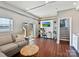 Bright living room with built-in shelves, a cozy couch, and access to outdoor stairs, offering comfort and convenience at 2045 Manila Bay Ln, Tega Cay, SC 29708