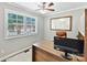 Bright office space with large windows and wood accents at 2045 Manila Bay Ln, Tega Cay, SC 29708