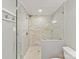 This updated shower features stone tile and glass door at 2045 Manila Bay Ln, Tega Cay, SC 29708
