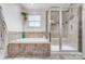 Relaxing bathroom with a soaking tub, separate shower, and decorative tile accents at 2065 Taney Way, Indian Land, SC 29707
