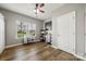 Bright bedroom with hardwood floors, ceiling fan, and natural light from the window at 2065 Taney Way, Indian Land, SC 29707