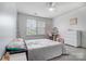 Bright bedroom with carpet, a ceiling fan and a writing desk in front of a window at 2065 Taney Way, Indian Land, SC 29707
