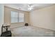 Bedroom featuring carpet, a ceiling fan, and a window with a view of the outside at 2065 Taney Way, Indian Land, SC 29707