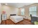 Bedroom featuring wood floors, a ceiling fan, and a window with a view of the outside at 2065 Taney Way, Indian Land, SC 29707