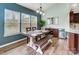 Dining room features hardwood floors, modern light fixture, lots of windows, and view to the backyard at 2065 Taney Way, Indian Land, SC 29707