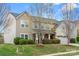 Charming two-story home with mature trees, established bushes and well-maintained lawn at 2065 Taney Way, Indian Land, SC 29707