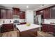 Beautiful kitchen with hardwood floors, stainless steel appliances, white backsplash, and a kitchen island at 2065 Taney Way, Indian Land, SC 29707