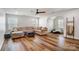 Bright living room with a comfortable sectional sofa, ceiling fan, and ample natural light at 2065 Taney Way, Indian Land, SC 29707